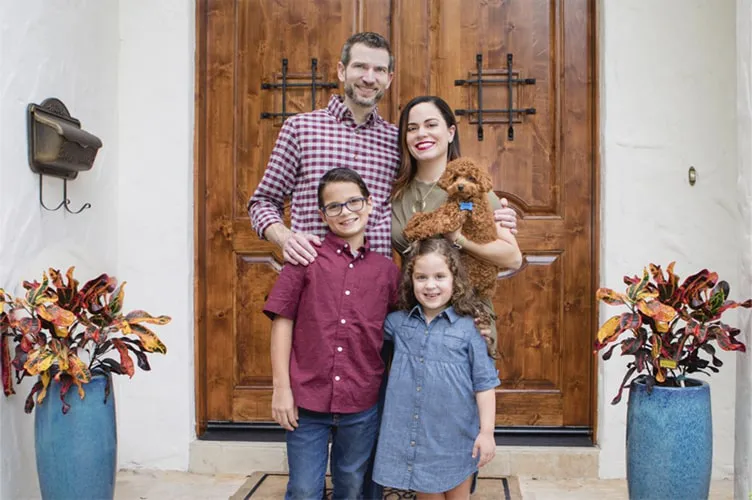Attorney Michael T. Gibson with his wife and children outside his Orlando law office